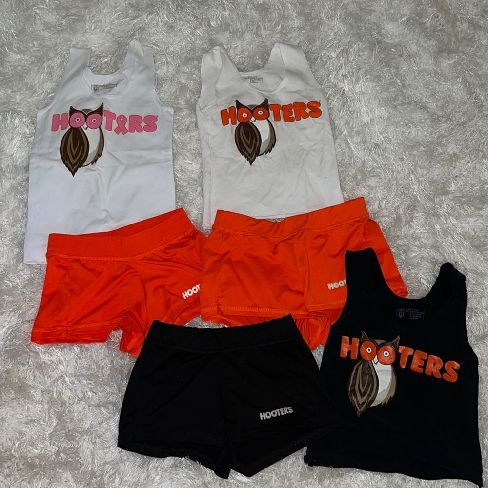 Three hooters girl uniforms, includes my name tag! Special addition pink logo